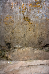 Old cracked grungy wall in a narrow street