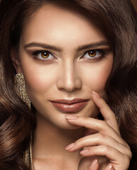 Beauty Woman Face Make up. Fashion Model Close up Portrait. Lips and Smokey Eyes Makeup. Beautiful Brunette with Gloss Lipstick looking at Camera