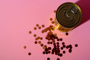Canned food tin on pink studio background
