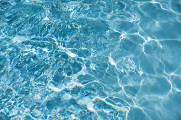 Water in swimming pool, background with high resolution. Wave abstract or rippled water texture.