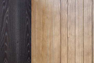 Elegant contemporary wainscoting made of toned light and black ash lumber planks as textured...