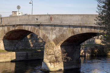 Robecco sul Naviglio ( MI ), Italy - April 01, 2021: An old bridge Robecco sul Naviglio town and Naviglio Grande, Milano, Lombardy, Italy