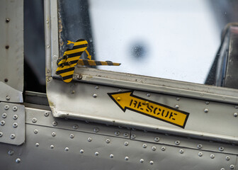 Aeroplane jet rescue pilots canopy release with yellow arrow and text pointing to pull cord for...