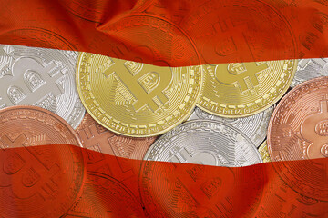 Mining in Austria. Bitcoins on the background of the Austria flag. Concept for investors in cryptocurrency and Blockchain technology in Austria