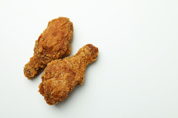 Tasty fried chicken on white background, close up