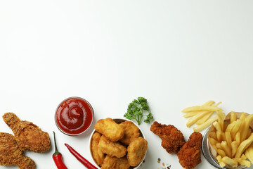 Concept of tasty eating with fried chicken on white background