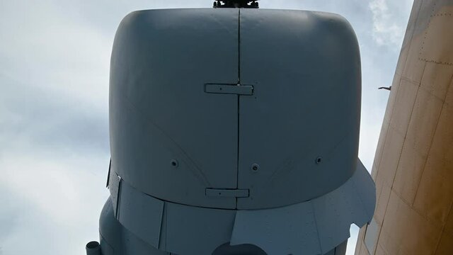 Close up view of decommissioned aero plane, a memorial to partisans and their help to Allied air forces during WWII. Aircraft exhibit in Slovenia. View under the airplane. Tilt down