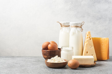Farm dairy products. Bottle milk, cheeses, cottage cheese, eggs, yogurt, butter. Organic food - obrazy, fototapety, plakaty