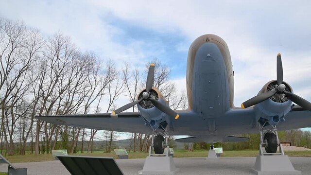 Decommissioned aeroplane, a memorial to partizans and their help to Allied air forces during WWII. Aircraft exhibit in Slovenia. Wide angle, right pan