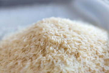 Raw white polished milled edible rice or jasmine rice.
