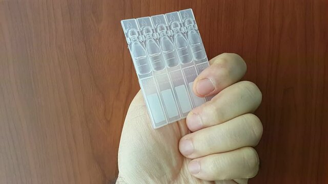 artificial tear drop in plastic container