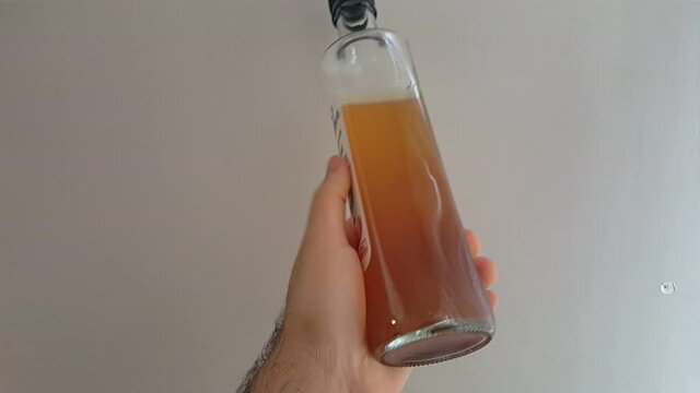 Natural organic vinegar in glass bottle