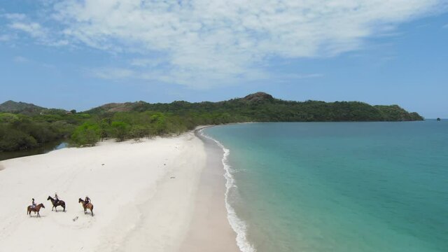 Costa Rica Beach next to W Hotel Reserva Conchal. Shot on DJI FPV. Zooming past the horses.