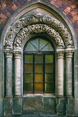 Obraz premium Old window of the Potocki family burial vault in Pechera, Ukraine
