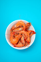 boiled gresh tasty shrimps in small white bowl