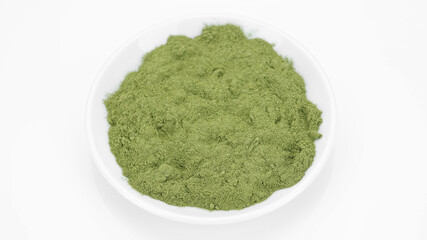 green powder superfoods chlorella or spirulina isolated on white background.