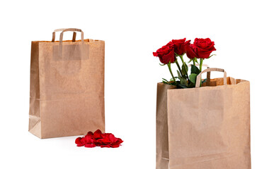 Beautiful roses in paper bag on a light background. Free space for text. Mockup for your design and...