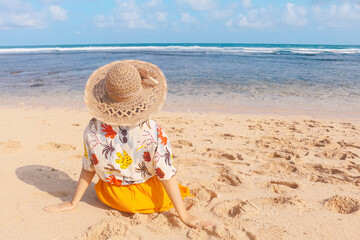 Portrait of happy smiling Asian woman enjoys a holiday at the beach.