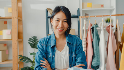Portrait of young Asia lady fashion designer feeling happy smile, arms crossed and looking to...