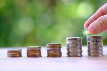 saving money concept, stacking coins with globe on table background, Advertising coins of finance and banking, business growth concept