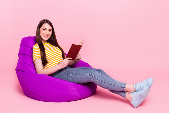 Full body profile side photo of young girl happy positive smile read story free-time isolated over pastel color background