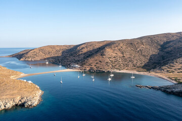 Fototapeta na wymiar Kolona Fykiada double sided sandy beach, aerial drone view. Greece, Kithnos island, Cyclades.