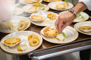 Elaboration of design dishes. Scenes of real teamwork by great Spanish professionals of gourmet haute cuisine for social events