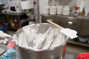 Cream in the kettle. Scenes of real teamwork by great Spanish professionals of gourmet haute cuisine for social events