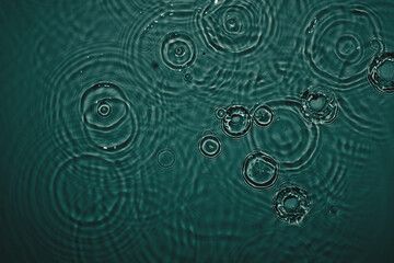 Dark green transparent clear calm water surface texture with ripples, splashes Abstract nature...
