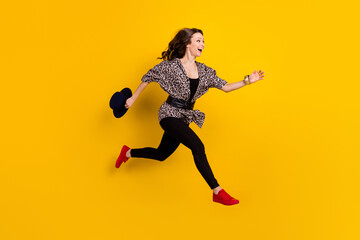 Fototapeta na wymiar Full length body size view of attractive chic slim fashionable cheerful girl jumping running isolated on shine yellow color background
