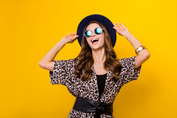 Photo of charming nice dreamy young woman wear hat look empty space rich lady isolated on yellow color background