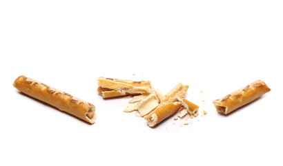 Broken cracker pretzel sticks snack isolated on white background