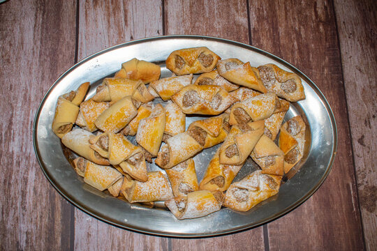 Sweet bakery prudcts with nutts inside covered with sugar