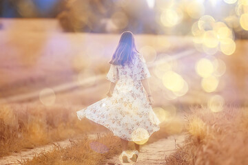 happy girl freedom in summer field, glare of the sun abstract background france provence autumn