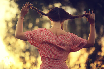 pigtails view from the back, young adult girl rustic style happiness freedom summer, no face