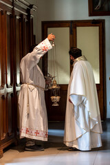 priests during the holy mass in the church of sacro cuore terni