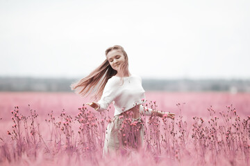 Fototapeta na wymiar pink field girl freedom, nature springtime summer nature portrait