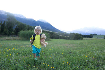 Children hiking in Alps mountains. Kids outdoor