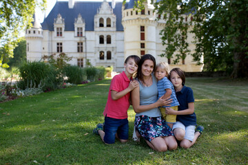 Child, toddler boy, playing in gardens of the Azay Le Rideau castle in Loire valley
