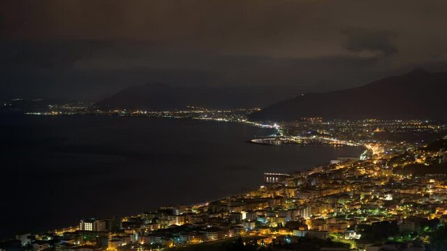Borgio Verezzi, Italy. May 22th, 2021. Time lapse zoom out of a night view from Verezzi on the Ligurian Riviera of Borgio Verezzi, Pietra Ligure, Loano, Ceriale and Albenga in the background.