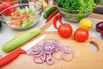 Vegetables on the kitchen table. Healthy food products on the table in the kitchen.