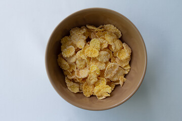 brown breakfast cereal plate on white background
