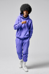 Young black man wear of blue set of tracksuit isolated on gray background - obrazy, fototapety, plakaty