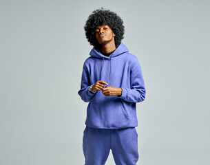 Handsome black man in blue set of tracksuit with afro hair
