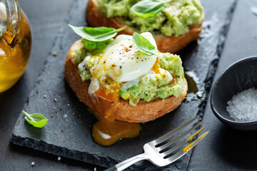 Tasty fresh toast with avocado and egg - 436835963