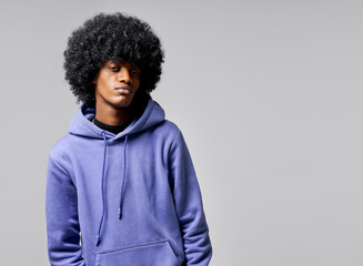 Fototapeta na wymiar Portrait of black man in blue hoodie with afro hair