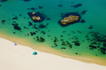 aerial view of summer beach with sea rocks in the jade sea