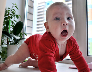 a child plays with a toy constructor
