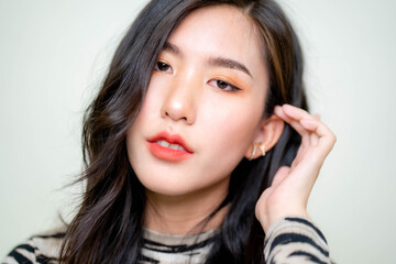 Fototapeta premium Beautiful young asian woman with clean fresh skin on white background. Asian women portrait.