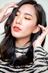 Fototapeta premium Beautiful young asian woman with clean fresh skin on white background. Asian women portrait.